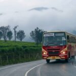 KSRTC Munnar Package bus travelling through the scenic hills of Munnar